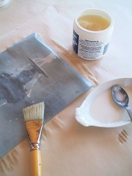 Thin paste with warm water to the thickness of syrup. We used a great water-based, nontoxic, acid-free paste called Yes! Paint lightly on the back of the transparent print.